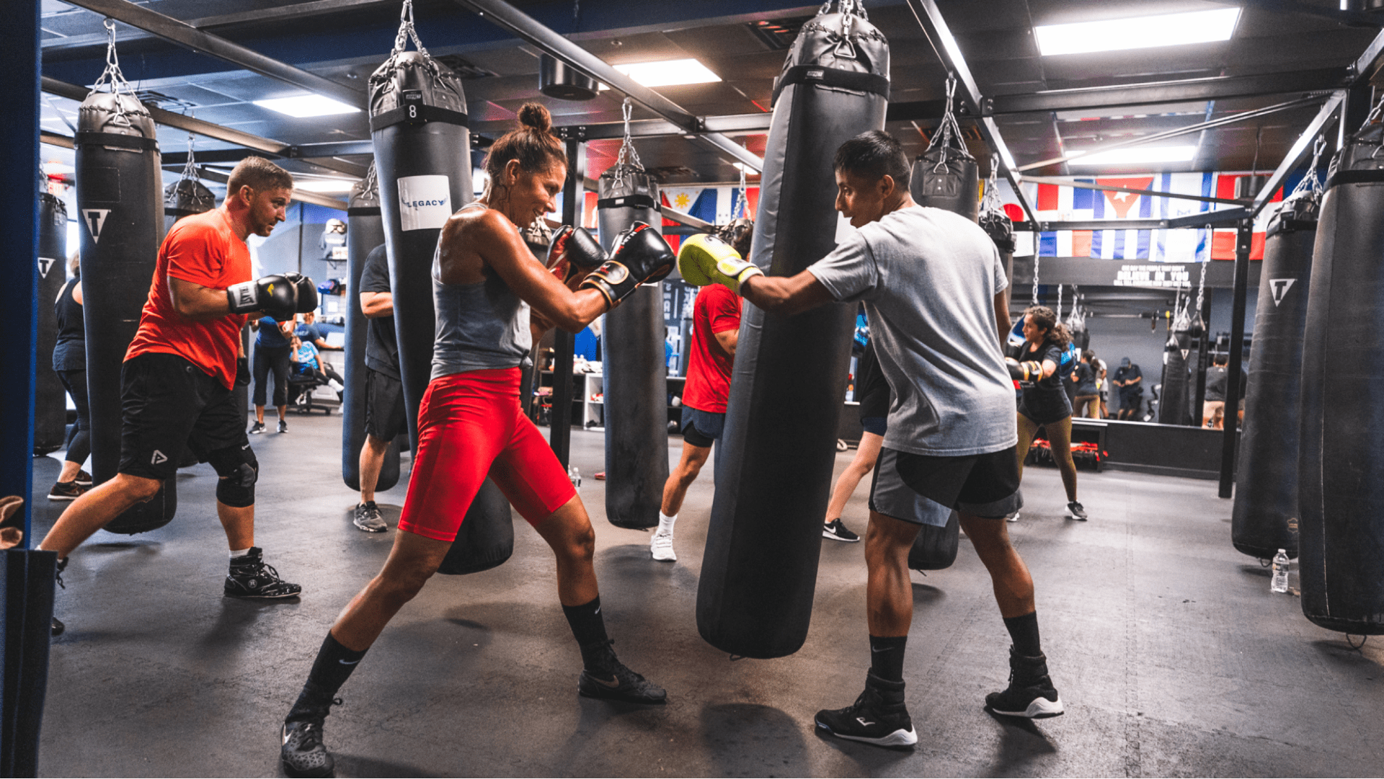 Two people touching boxing gloves