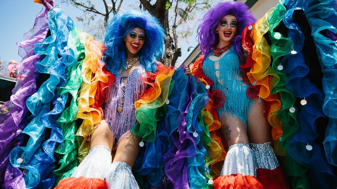 two amazing costumes at a pride parade